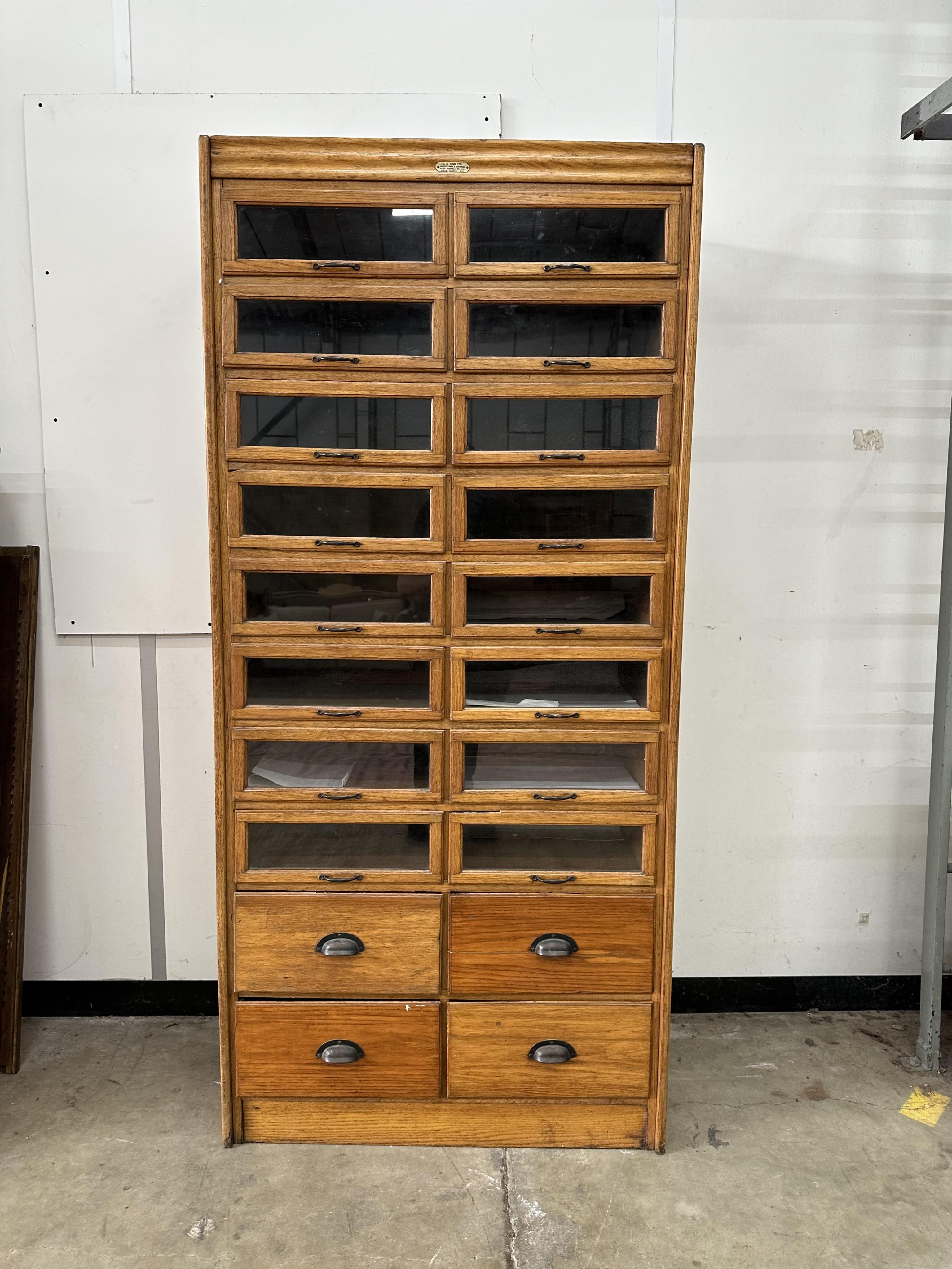 A mid century oak twenty drawer haberdashery cabinet, width 91cm, depth 49cm, height 198cm. Condition - good